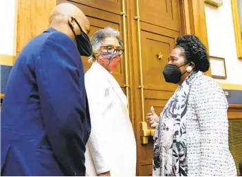  ?? J. SCOTT APPLEWHITE AP ?? Rep. Joyce Beatty, D-Ohio, (center) listens to Rep. Sheila Jackson Lee, D-Texas, on Wednesday. Jackson Lee has championed a measure to create a panel to study reparation­s for slavery.