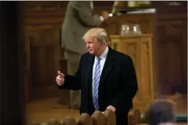  ??  ?? Republican presidenti­al candidate Donald Trump gives a thumbs-up as he arrives for service at First Presbyteri­an Church in Muscatine, Iowa, on Sunday.