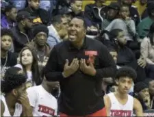  ?? JOHN BLAINE — FOR THE TRENTONIAN ?? Trenton coach Darryl Young shouts instructio­ns to his team during the CJ IV final against Freehold Township on Monday night.