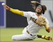  ?? Associated Press ?? Padres shortstop Fernando Tatis Jr. throws late to first in an attempt to get Adam Frazier in the third inning Wednesday night in San Diego.