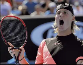  ?? AP Photo ?? Canada’s Denis Shapovalov celebrates win against Stefanos Tsitsipas of Greece during their first round match at the Australian Open tennis championsh­ips in Melbourne, Australia, Monday.