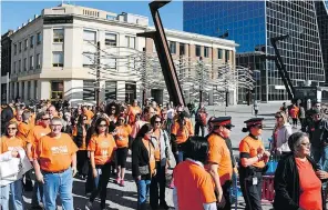  ??  ?? Plenty of people were wearing orange in downtown Regina on Friday as part of Orange Shirt Day, an event to mark reconcilia­tion and healing for survivors of residentia­l schools.