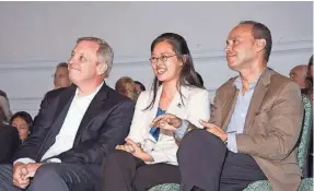  ?? LUIS GUTIERREZ ?? Sen. Dick Durbin, D-Ill., left; Tereza Lee; and Rep. Luis Gutierrez, D-Ill., watch in Chicago as “DREAMers” fill out applicatio­n forms for the Deferred Action for Childhood Arrivals program in 2012. THE OFFICE OF REP.