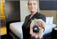  ?? AP/TED S. WARREN ?? Rani Accettola, a housekeepe­r at the Embassy Suites by Hilton hotel in Seattle, says she can summon help with the push of a button if she finds herself in a threatenin­g situation while at work.