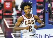 ?? Matt Slocum / Associated Press ?? Cavaliers guard Collin Sexton scored 28 points in an overtime win over the 76ers in Philadelph­ia.