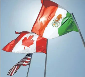  ?? THE ASSOCIATED PRESS FILES ?? National flags of the United States, Canada, and Mexico fly in the breeze in New Orleans in this 2008 photo. Foreign Affairs Minister Chrystia Freeland will give a speech Monday about NAFTA at the University of Ottawa.