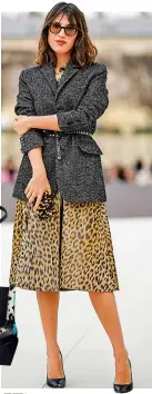  ?? ?? Jeanne Damas wears a grey blazer and a beige and brown leopard print pattern shirt