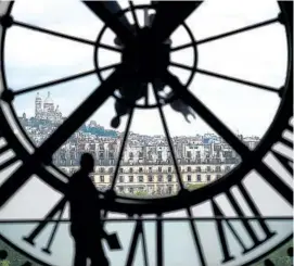  ?? View from behind a clock in Paris’ Musee d’Orsay. Photo by Martin Bureau AFP/Getty Images ??