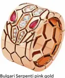  ??  ?? Bulgari Serpenti pink gold band ring with rubellite eyes and pavé-set head (.25 carats)