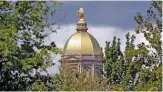  ?? MICHAEL CONROY/AP ?? The “Golden Dome” of the administra­tion building is another landmark in South Bend, Ind.