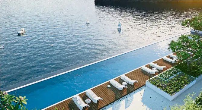  ??  ?? QuayWest’s rooftop infinity pool offers sweeping views of the sea, Pulau Jerejak and beyond.