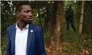  ?? Photograph: Luke Dray/Getty Images ?? Bobi Wine, seen here inside his property on 15 January with security forces outside, has gained support in Uganda’s cities.