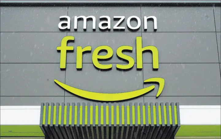  ?? Matt Rourke The Associated Press ?? Amazon is removing Just Walk Out technology, a cashier-less checkout system, from its Amazon Fresh stores as part of an effort to revamp the grocery chain.