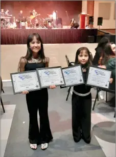  ?? COURTESY PHOTO ?? Ten-year-old Jasmine Monique Sandoval and her sister, 7-year-old Jaelyn Therese Sandoval of Taos, show some swagger on the day of their performanc­es at the New Mexico Hispano Music Associatio­n’s annual music competitio­n.