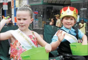  ?? DIGITAL FIRST MEDIA FILE PHOTO ?? Dogwood princess Victoria Cirelos and prince Jake Gray ride in the Dogwood Festival throwing candy to kids that were watching along Bridge Street.