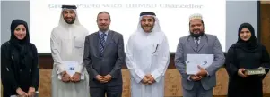  ??  ?? Top officials of Hamdan Bin Mohammed Smart University with the winners of ‘Reading Knights’.