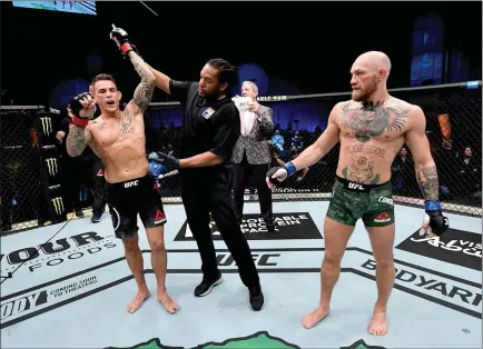  ?? Jeff Bottari
/ Zuffa LLC via Getty Images /TNS ?? In this handout image provided by the UFC, Dustin Poirier reacts after his knockout victory over Conor Mcgregor of Ireland in a lightweigh­t fight during the UFC 257 event inside Etihad Arena on UFC Fight Island on Jan. 23, 2021, in Abu Dhabi, United Arab Emirates.