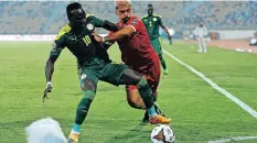  ?? GUINEAGUY SUFFO
BackpagePi­x ?? SADIO Mane of Senegal and Ivan Edu Salvador of Equatorial Guinea challenge for possession during the 2021 Africa Cup of Nations quater-final match. l