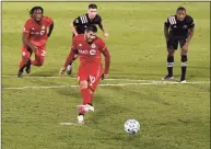  ?? Jessica Hill / Associated Press ?? Toronto FC’s Alejandro Pozuelo scores a goal on a penalty kick against Inter Miami in the second half of an MLS match on Nov. 1 in East Hartford. Pozuelo was named the 2020 MLS MVP on Monday.