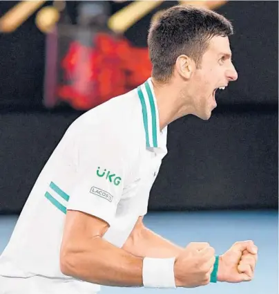  ?? WILLIAM WEST/GETTY-AFP ?? Top-ranked Novak Djokovic celebrates after beating Daniil Medvedev in straight sets to win his 18th Grand Slam title.