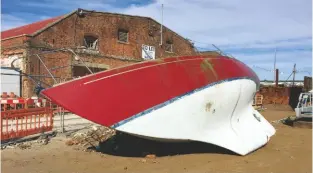  ??  ?? RIGHT An old yacht arrives at the Boatbreake­rs yard in Portsmouth ready to be dismantled