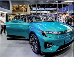  ?? PROVIDED TO CHINA DAILY ?? Visitors check out a Byton electric concept vehicle at the Beijing Internatio­nal Automotive Exhibition in Beijing on April 26.