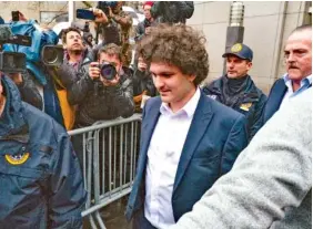  ?? AP PHOTO/CRAIG RUTTLE ?? In January, FTX founder Sam Bankman-Fried leaves Manhattan federal court in New York after he pleaded not guilty to charges he cheated investors and looted customer deposits on his cryptocurr­ency trading platform.