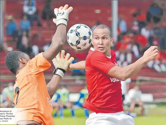  ?? Picture: RAMA ?? Lautoka goalkeeper Joela Biuvanua is challenged for the ball by Rewa’s Tevita Waranaival­u during their Vodafone Premier League clash at Ratu Cakobau Park in Nausori yesterday.