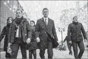  ?? AP/Navalny campaign/EVGENY FELDMAN ?? Russian opposition leader Alexei Navalny (center) heads to a meeting of Russia’s Central Election Commission on Monday in Moscow.