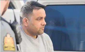  ?? MICHAEL BELL ?? Jagdish Singh Tehara arrives at Court of Queen’s Bench on Thursday to be sentenced for the stabbing death of his wife, Sandeep Kaur Tehara, who had told him she planned to take their children and leave him.