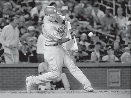  ?? Photograph­s by Billy Hurst Associated Press ?? MANNY MACHADO HAD a big game at the plate, with three hits and three RBIs, one on this solo home run in the seventh inning.