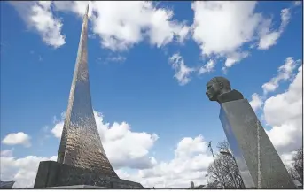  ?? (AP/Alexander Zemlianich­enko) ?? The bust of Gagarin and the 351-feet high titanium obelisk depicting a starting rocket is dedicated to the first cosmonauts in Moscow.