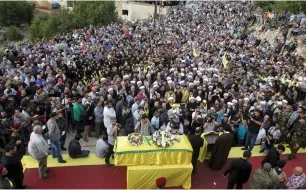  ??  ?? MOURNERS ATTEND the funeral of Hassan al-Haj, one of Hezbollah’s top commanders, who was killed fighting alongside Syrian army forces in Idlib province, in his hometown of al-Luwaizeh, southern Lebanon, on Monday.