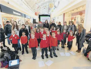  ??  ?? Pupils, staff and parents from Barnes Infants were singing festive songs in The Bridges in this photo from seven years ago.