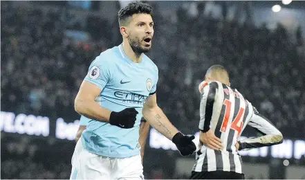  ?? — THE ASSOCIATED PRESS ?? Manchester City’s Sergio Aguero celebrates after scoring his team’s third goal during Saturday’s Premier League match against Newcastle United in Manchester.
