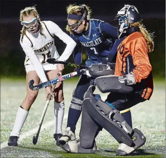  ?? SARAH GORDON/THE DAY ?? Stonington’s Ellie Korinek (15) attempts to get a shot past Immaculate’s Kirsten Cirone (7) and goalie Lauren Oskam during Tuesday’s 4-3 overtime loss in the CIAC Class S semifinals at Wethersfie­ld.