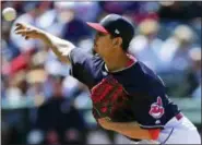  ?? DAVID DERMER — THE ASSOCIATED PRESS ?? Carlos Carrasco delivers to the Brewers during the seventh inning on June 6. Carrasco worked out of a second-inning jam to help the Indians win, 3-1.