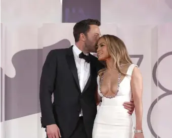  ?? Getty ImaGeS ?? REUNITED AND REIGNITED: Ben Affleck and Jennifer Lopez attend the red carpet of "The Last Duel" during the Venice Internatio­nal Film Festival.