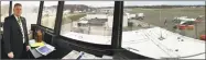  ?? Dan Haar / Hearst Connecticu­t Media ?? A panoramic composite photo of Tweed New Haven Airport through windows of the old tower, now the office of Timothy Larson, shows the main runway leading toward a neighborho­od on the New Haven-East Haven line and the row of houses across Burr Street...