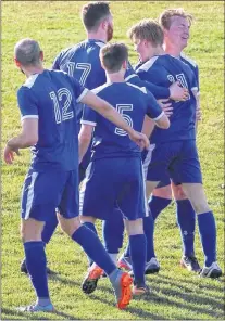  ?? SUBMITTED PHOTO ?? Members of the Paradise team celebrate a goal against Mount Pearl earlier this week. Paradise won the game 3-1, recording its first-ever victory in provincial Challenge Cup play.