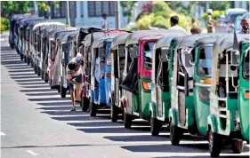  ?? — AP/PTI ?? Autoricksh­aws are parked in a queue for gasoline near a fuel station in Colombo, on Thursday.