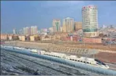  ?? VCG VIA GETTY IMAGES ?? A highspeed train runs across Urumqi, Xinjiang province, during a test run.