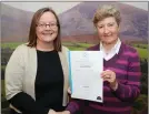  ??  ?? Elaine Buckley received her Level % Care Support cert from Women’s Forum chair Judy O’Leary.