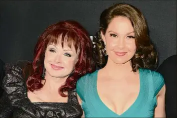  ?? Jordan Strauss / Associated Press file photo ?? Actor Ashley Judd, right, seen with her mother, country star Naomi Judd, said in an interview with Diane Sawyer on “Good Morning America” that her 76-year-old mother died of a self-inflicted gunshot wound on April 30.