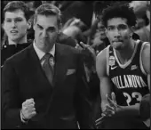  ?? Associated Press ?? FIST PUMP Villanova head coach Jay Wright and forward Jermaine Samuels (23) celebrate a win on Jan. 25. Villanova will begin the college basketball season at No. 3.