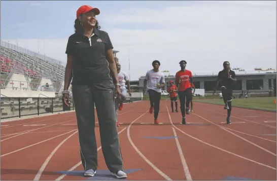  ?? [BROOKE LAVALLEY/DISPATCH] ?? Karen Dennis is the director of Ohio State’s track and field teams for both men and women. She was the first woman to be named Big Ten coach of the year for a men’s team after the Buckeyes won the conference outdoor meet.