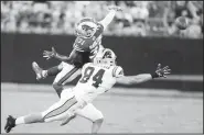  ?? AP/MIKE MCCARN ?? Buffalo Bills strong safety Dean Marlowe (31) tips the ball intended for Carolina Panthers tight end Jason Vander Laan (84) during the first half Friday in Charlotte, N.C.