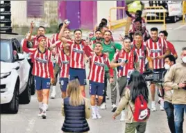  ?? AFP ?? Atletico players celebrate outside the Jose Zorilla stadium after winning La Liga.