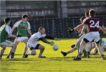  ??  ?? Ross McLoughlin comes off his line to make a save. Pic: Carl Brennan.