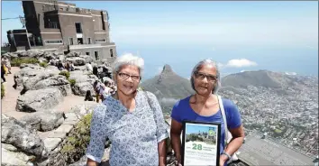  ?? LUIGI BENNETT PHOTOGRAPH­Y ?? Mildred Garrett of Somerset West became the 28th millionth user of the Table Mountain Cableway. She was accompanie­d by her sister, Elizabeth Titus. |